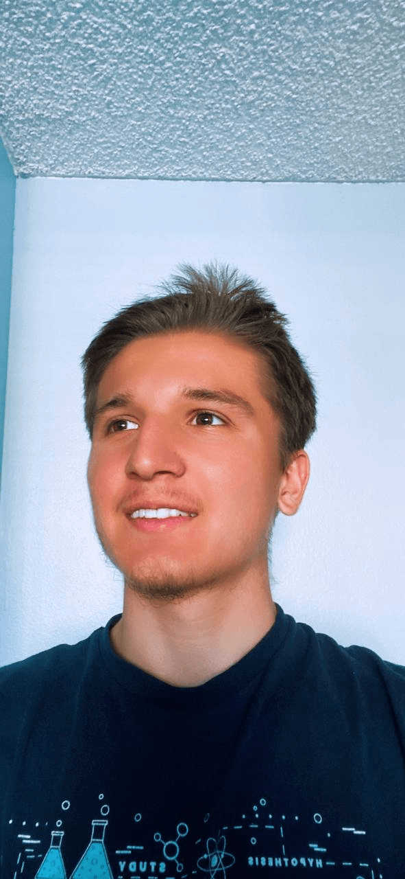 Khasanjon Bobokhojaev smiling and looking to the side
